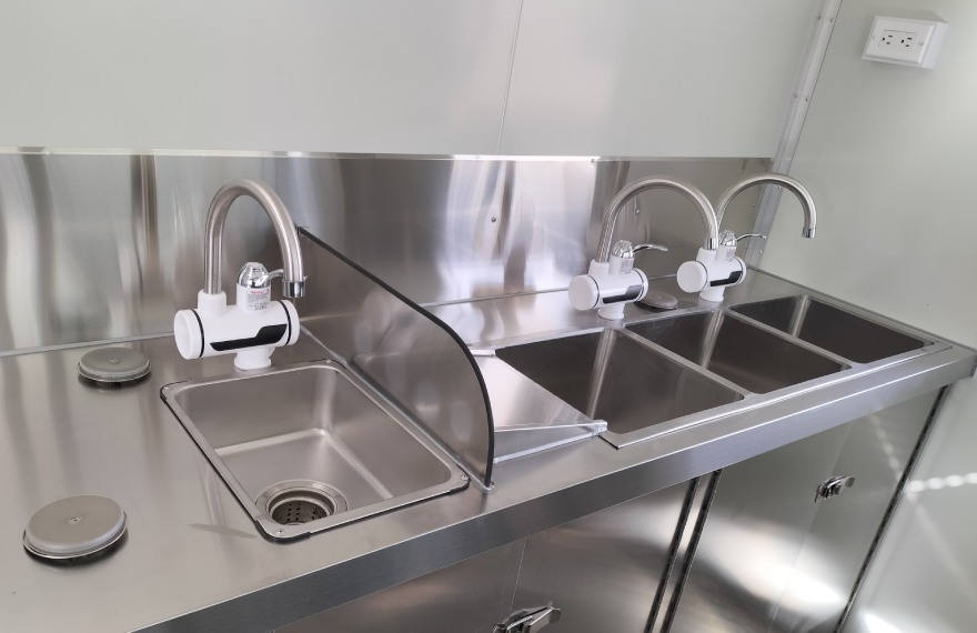 3 compartment water sink and hand sink in the burger food trailer